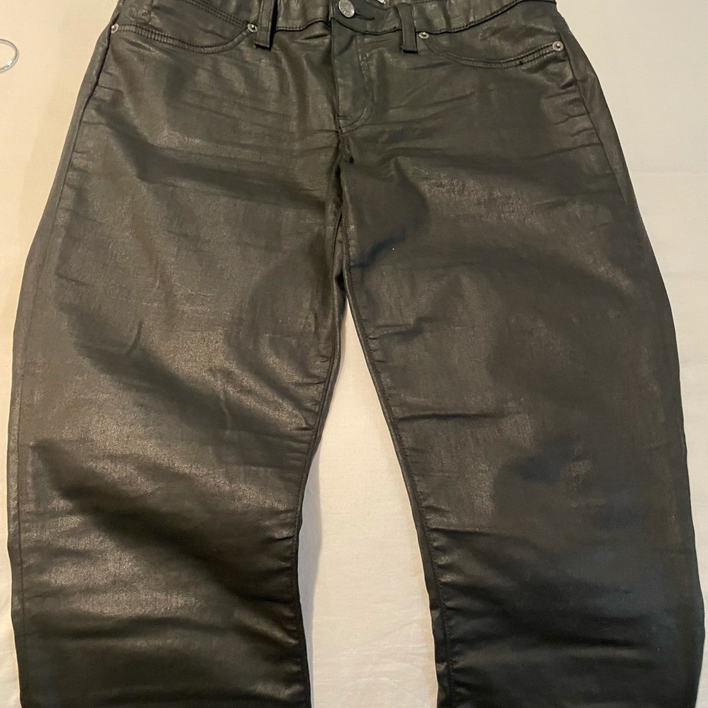 Black coated jeans , mid-rise straight leg w/ankle zippers .cool for the season!
